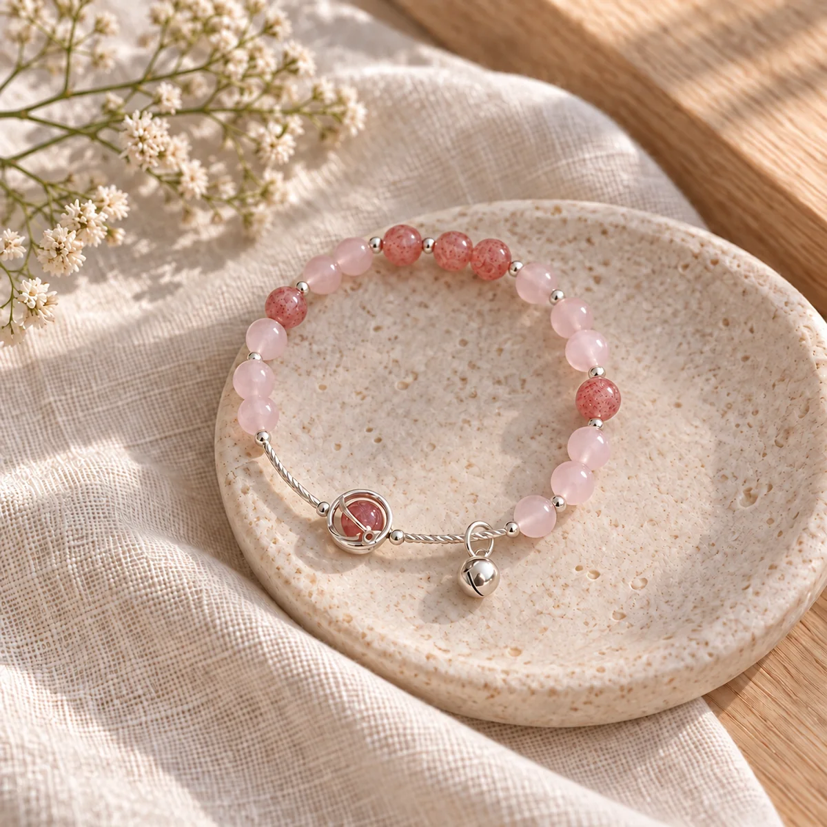Starlight Strawberry Quartz Bracelet in a warm styled scene without an extension chain